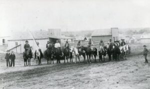 Iowas On Horseback in front of Nowlan's Restaurant, Guthrie I.T. 1889