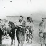 Iowa Indians Walking Around Guthrie, I.T. with White Man 1889